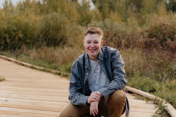 River Walters in his third year of broadcast posing for senior photos.