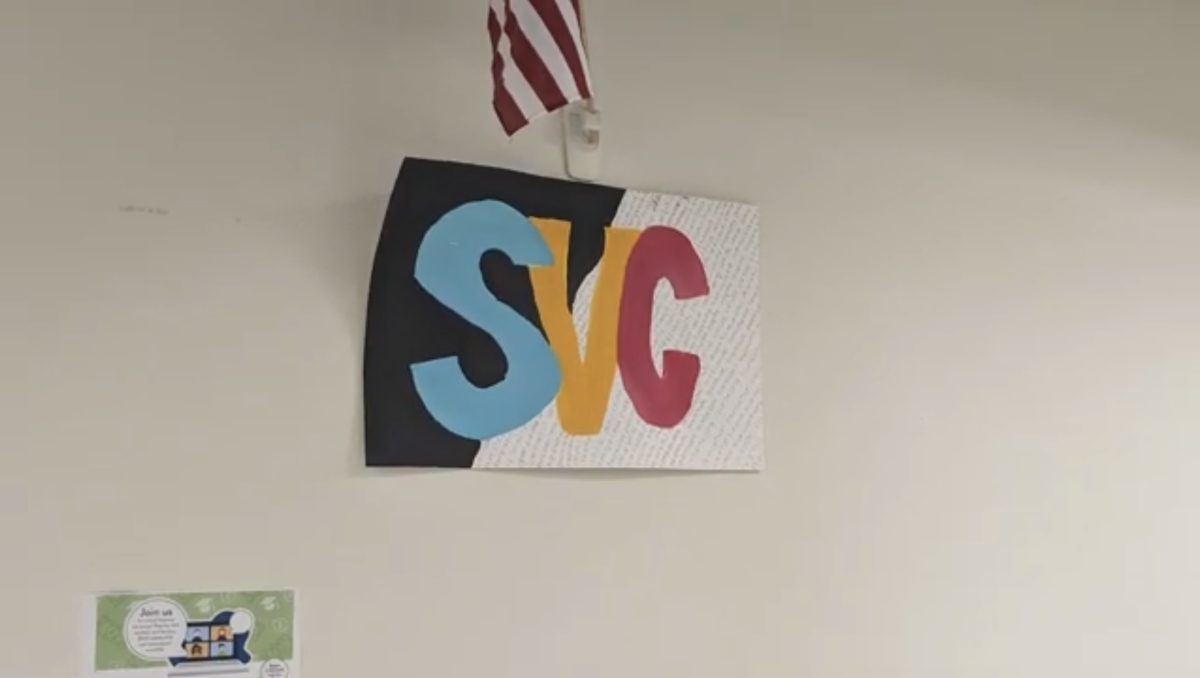 Posters for SVC hang around the building, representing the group.