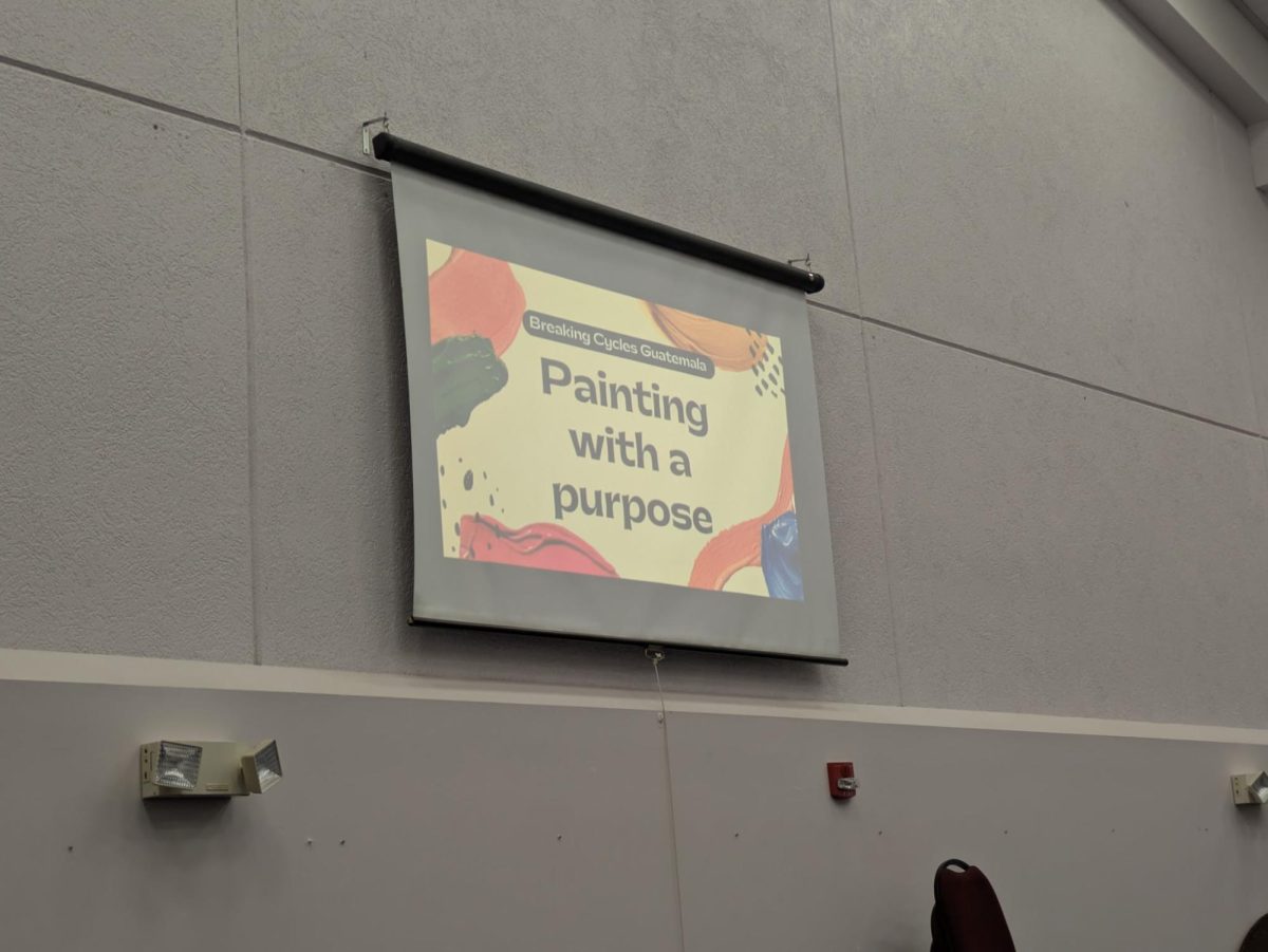Grace Cerezo's instructional slides playing at her Capstone event.