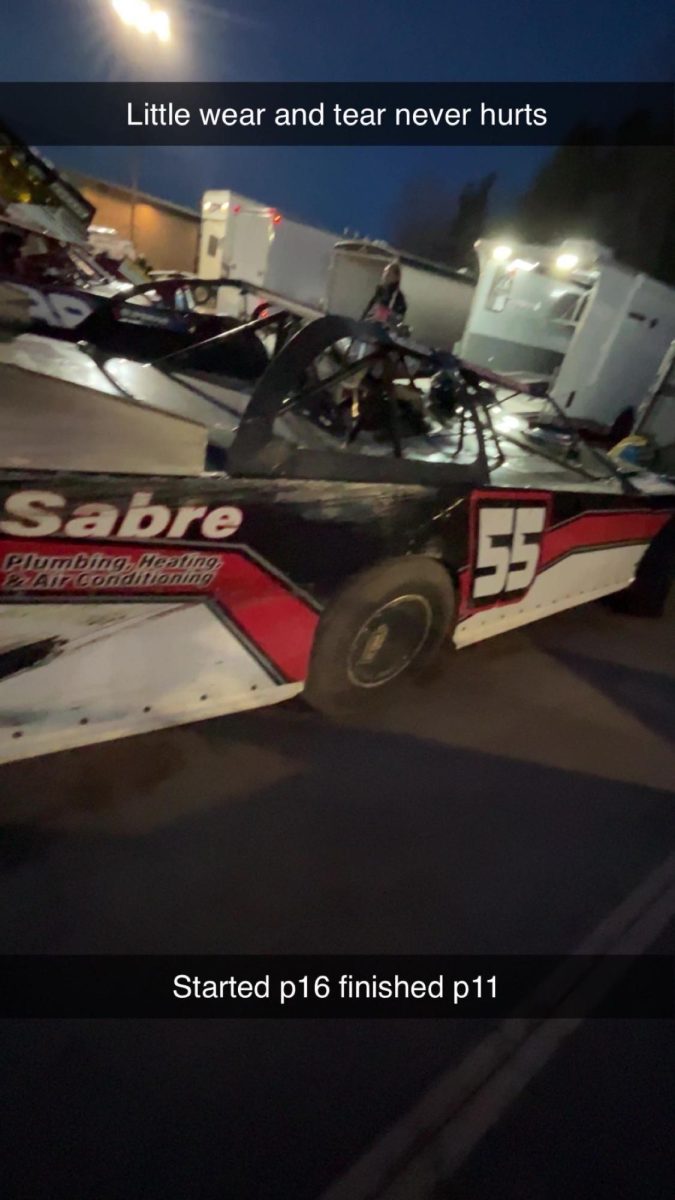 Clayton Hofteig looking at the damage after a race after he finished 11th.