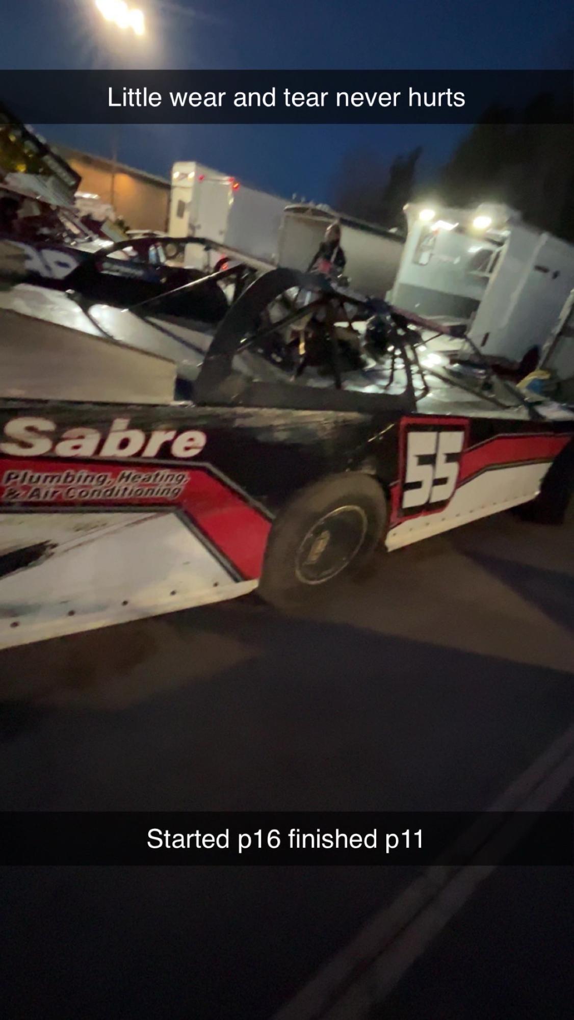 Clayton Hofteig looking at the damage after a race after he finished 11th.
